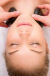 Woman Having Hot Stone Massage Her Neck Stock Photo