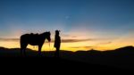 Horsemen At Mount Bromo Sunrise Stock Photo