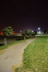 Night Public Park In The City With Houses Near Stock Photo