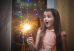 Little Girl Holding A Sparkler Stock Photo