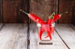 Red Hot Chilli Peppers In Glass Of Water Stock Photo