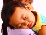 Baby Sleeping On Mother S Shoulder Stock Photo