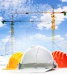 Safety Helmet Against Sketching Of Building Construction With Li Stock Photo