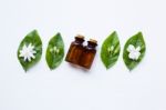 Essential Oil With Jasmine  Flower On White Background Stock Photo