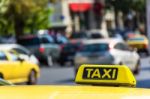 Yellow Taxi Sign On Cab Vehicle Roof Stock Photo