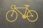 Yellow Bicycle Sign On Track Road Stock Photo