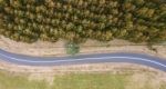 Road And Field In The Tasmanian Countryside Stock Photo