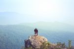 Instagram Filter Young Man Asia Tourist At Mountain Is Watching Over The Misty And Foggy Morning Sunrise, Travel Trekking Stock Photo