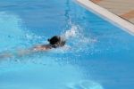 Female Swimming The Crawl Stock Photo