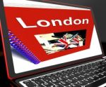 London Book On Laptop Shows Britain Guide Stock Photo