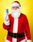 Male In Santa Costume Posing With His Cash Card Stock Photo