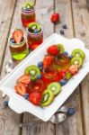 Red And Green Jelly Served With Fruit Stock Photo