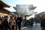 Tokyo, Japan - Nov 21: Buddhists Gather Around A Fire To Light I Stock Photo