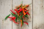 Chilli On Wooden Floor Stock Photo