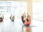 Asian Woman Doing Yoga Indoors Stock Photo