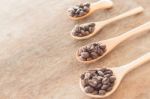 Coffee Spoons On Grunge Wooden Table Stock Photo