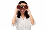 Businesswoman Enjoying View Through Binoculars Stock Photo