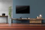 Led Tv On Concrete Wall With Wooden Furniture In Living Room Stock Photo