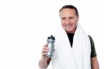 Handsome Man Holding Bottle In Hand Stock Photo