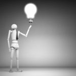 The Wooden Doll With Light Bulb Stock Photo