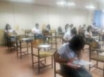 Blur Background University Students Writing Answer Doing Exam In Stock Photo