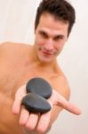 Close-up Young Man With Stones Palm Stock Photo