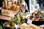 Assorted Fresh Salads Displayed On A Buffet Stock Photo