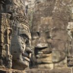 Ancient Stone Faces Of King Jayavarman Vii At The Bayon Temple, Stock Photo