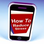 How To Reduce Stress Phone On Notebook Shows Reducing Tension Stock Photo