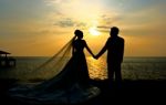 Wedding Couple At Sunset Stock Photo