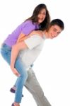 Teenage Boy Piggybacking Girl Stock Photo