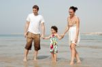 Family  In The Beach Stock Photo