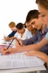 Teenage students Writing On book Stock Photo