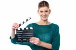 Young Girl Posing With Clapperboard Stock Photo