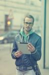 Man On Street Use Ipad Tablet Computer Stock Photo