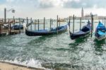 Gondolas Moored At The Entrance To The Grand Canal Stock Photo