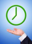 Green Clock On Hand Stock Photo