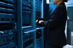 People Fix Server Network In Data Room Stock Photo