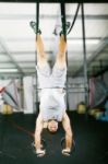 Man Balancing On Ring Stock Photo