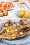 Grilled European Seabass With Potato And Tomato Salad Stock Photo