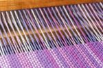 Detail Of Fabric In Comb Loom With Ultraviolet And Lilac Colors Stock Photo