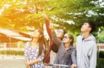 Group Of Asian Teenager Walking In The Park  Stock Photo