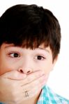 Female Closing Mouth Of Small Boy Stock Photo