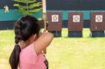 Young Girl Holding The Bow Stock Photo