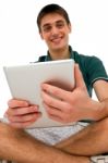 Teenage Boy Using Ipad Stock Photo