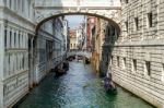 Gondoliers Ferrying People In Venice Stock Photo