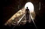 Man Standing In Train Tunnel Stock Photo