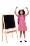 Jubilant Little Girl In School Uniform Stock Photo