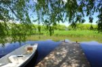 Trees And A Boat  Near The Lake And River Stock Photo