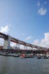 Lisbon's Docks Under April 25th Bridge Stock Photo